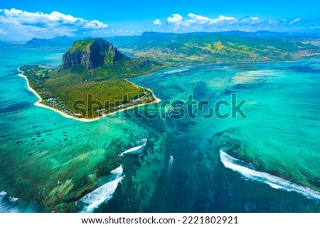 Aerial view of Mauritius island and Le Morne Brabant mountain with beautiful blue lagoon and underwater waterfall illusion 