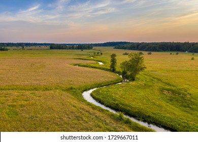 Aerial view of meandering lowland river Koningsdiep near Beetsterzwaag in the Netherlands - Shutterstock ID 1729667011