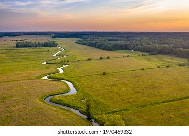 Aerial view of meandering lowland river Koningsdiep near Beetsterzwaag in the Netherlands - Shutterstock ID 1970469332