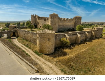 Aerial view of medieval Almenar castle near Soria Spain, four round towers protect the inner courtyard, surrounded by fortified outer walls