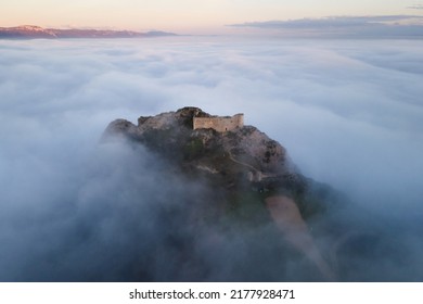 Aerial view of a medieval Castle in a beautiful foggy sunset, Poza de la sal, Burgos, Spain. High quality photography . 