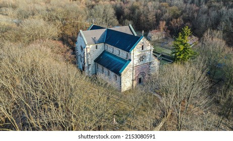 aerial view of medieval church deep in the forest