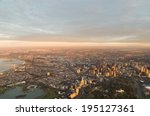 Aerial view of Melbourne, Australia at sunrise.  Albert Park is in the foreground on the left, the botanical garden on the right.