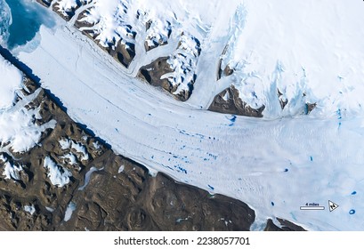 Aerial view of meltwater lakes forming on the surface of Greenland’s Petermann Glacier. Digitally enhanced. Elements of this image furnished by NASA.   - Powered by Shutterstock