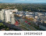 Aerial view of metro station, shopping centre, and nearby high-rise apartments, Castle Hill, Australia.