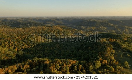 Aerial view of the Midwest USA in autumn. Rural landscape, countryside, wooded hills