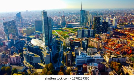 Aerial view of Milan city skyline.  the modern urban landscape of business buildings. Aerial footage showing new skyscrapers. POV. Palazzo Regione Lombardia. Milan Italy 30:11:2020: 