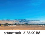 Aerial view of the mining city of Calama in northern Chile with Chuquicamata copper mine in the back.