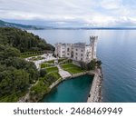 Aerial view of the Miramare Castle near Trieste in Italy. Beautiful Castle by the Italian Sea with exotic botanic garden.