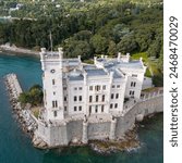 Aerial view of the Miramare Castle near Trieste in Italy. Beautiful Castle by the Italian Sea with exotic botanic garden.