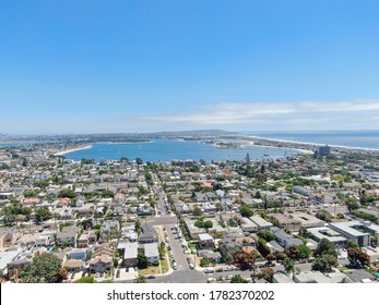 Aerial view of Mission Bay and Pacific Beach in San Diego, California. USA. Community built on a sandbar with villas, sea port and recreational Mission Bay Park. Californian beach-lifestyle.