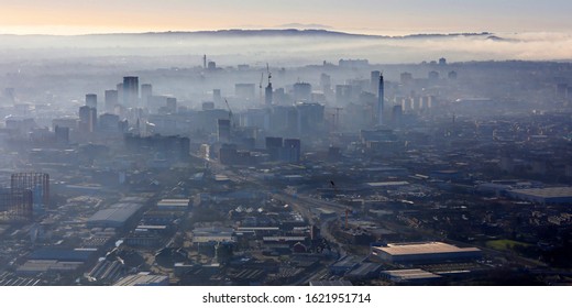 aerial view of a misty Birmingham skyline, UK