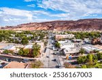 Aerial view of Moab, Utah along Main street. Moab is the largest city and county seat of Grand County in eastern Utah in the western United States, known for its dramatic scenery