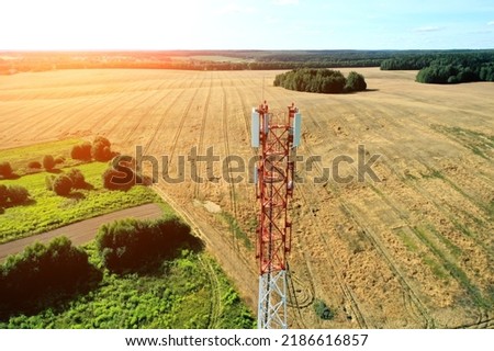 Aerial view of mobile phone cell tower over forested rural area of West Virginia to illustrate lack of broadband internet service.