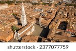 Aerial view of the Modena Cathedral and Torre della Ghirlandina, a bell tower. It is is a Roman Catholic church dedicated to the Assumption of the Virgin Mary and Saint Geminianus located in Italy.
