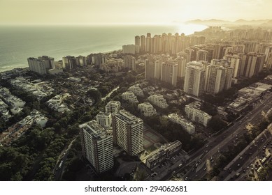 Aerial View Of Modern Brazilian City At Sunset With Light Leak, Barra Da Tijuca