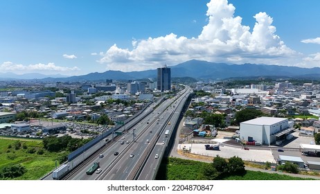 Aerial View Of Modern City And Highway. Drone Point Of View.