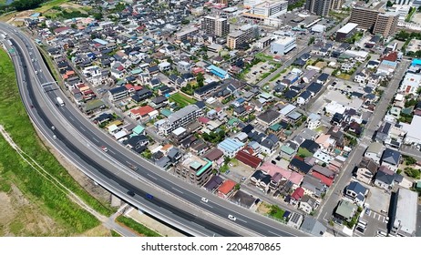 Aerial View Of Modern City And Highway. Drone Point Of View.