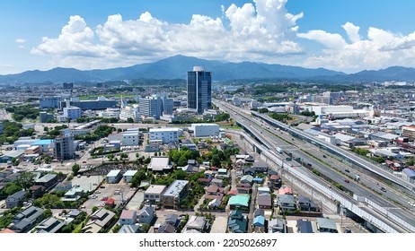 Aerial View Of Modern City And Highway. Drone Point Of View.