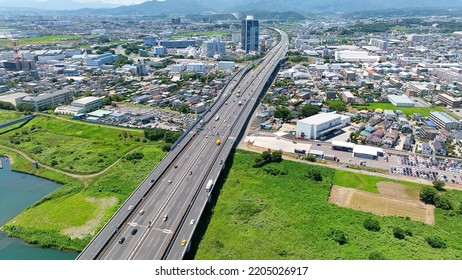 Aerial View Of Modern City And Highway. Drone Point Of View.