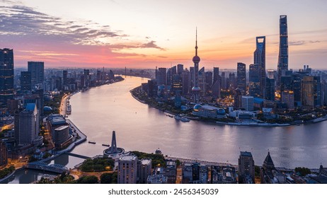 Aerial view of modern city skyline and buildings at sunrise in Shanghai. - Powered by Shutterstock