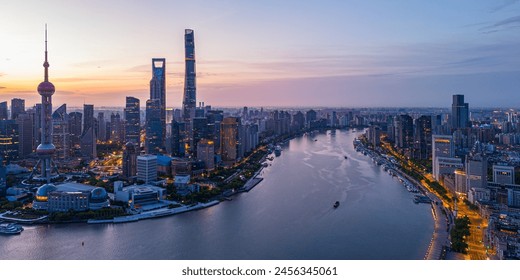 Aerial view of modern city skyline and buildings at sunrise in Shanghai. - Powered by Shutterstock