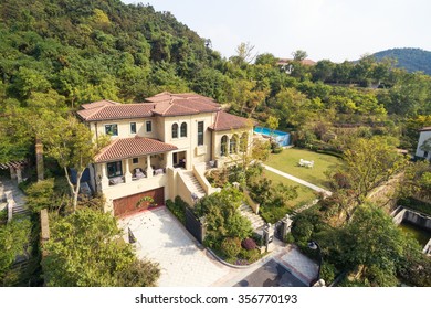 Aerial View Of Modern Villas At The Foot Of Hill