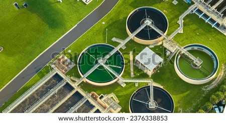Aerial view of modern water cleaning facility at urban wastewater treatment plant. Purification process of removing undesirable chemicals, suspended solids and gases from contaminated liquid Сток-фото © 