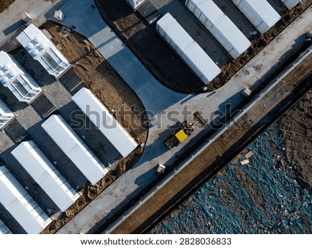 Aerial view of modular containerized energy storage power station under construction