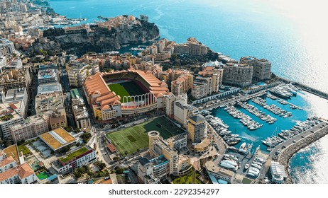 Aerial view of Monaco City and The Stade Louis II Stadium venue for football, home of AS Monaco, located in the Fontvieille district ft. famous Monte-Carlo, Cap d’Ail Marina, Monaco Ville 5.5K UHD  - Powered by Shutterstock