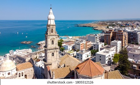 Aerial view of Monopoli in Apulia, south of Italy - Monopoli Cathedral aka Basilica of the Madonna della Madia from above, in front of the Adriatic Sea