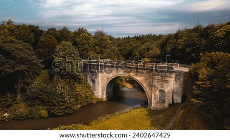 An aerial view of the Montagu Bridge over River North Esk in Dalkeith Country Park, Scotland