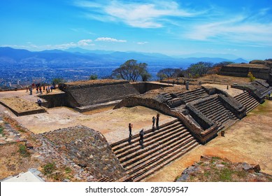 Aerial View Of Monte Alban Ruins, Oaxaca, Mexico With Mountains At The Background