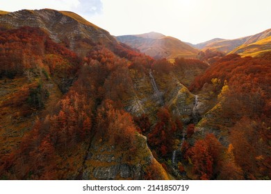 Aerial view of Morricana Waterfalls and the beeches forest during autumn season in Monti della Laga, Abruzzo, Italy