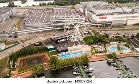 Aerial View. Moscow, Russia 06/2019: Merry Go Round In Vegas Trade Center Outside In Street. Ferris Wheel Myakinino, Krasnogorsk City. Pavshinskaya Poima. Musement Park, Urban Landscape Carousel. Pool