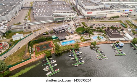 Aerial View. Moscow, Russia 06/2019: Merry Go Round In Vegas Trade Center Outside In Street. Ferris Wheel Myakinino, Krasnogorsk City. Pavshinskaya Poima. Musement Park, Urban Landscape Carousel. Pool