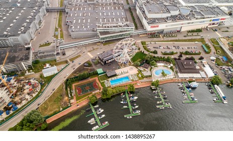 Aerial View. Moscow, Russia 06/2019: Merry Go Round In Vegas Trade Center Outside In Street. Ferris Wheel Myakinino, Krasnogorsk City. Pavshinskaya Poima. Musement Park, Urban Landscape Carousel. Pool