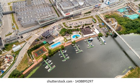 Aerial View. Moscow, Russia 06/2019: Merry Go Round In Vegas Trade Center Outside In Street. Ferris Wheel Myakinino, Krasnogorsk City. Pavshinskaya Poima. Musement Park, Urban Landscape Carousel. Pool