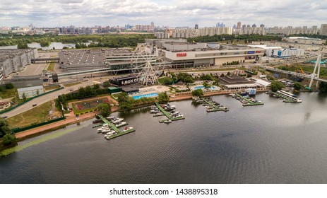 Aerial View. Moscow, Russia 06/2019: Merry Go Round In Vegas Trade Center Outside In Street. Ferris Wheel Myakinino, Krasnogorsk City. Pavshinskaya Poima. Musement Park, Urban Landscape Carousel. Pool