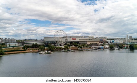 Aerial View. Moscow, Russia 06/2019: Merry Go Round In Vegas Trade Center Outside In Street. Ferris Wheel Myakinino, Krasnogorsk City. Pavshinskaya Poima. Musement Park, Urban Landscape Carousel. Pool