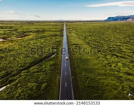 Aerial view of mossy lava field in Iceland, Europe. Greeen moss covered volcanic lava field. Long iceland road