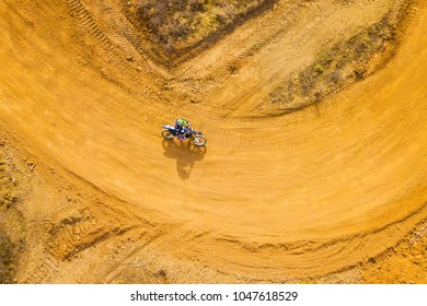 Aerial View Of Motocross Bike In Racetrack. Outdoor Motor Sport From Drone View.