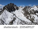 Aerial view of the Mount Heyburn and the frozen Upper bench lake. Shot in Sawtooth mountain range, Stanley, Idaho state, USA. 