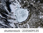 Aerial view of the Mount Heyburn and the frozen Upper bench lake. Shot in Sawtooth mountain range, Stanley, Idaho state, USA. 