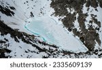 Aerial view of the Mount Heyburn and the frozen Upper bench lake. Shot in Sawtooth mountain range, Stanley, Idaho state, USA. 