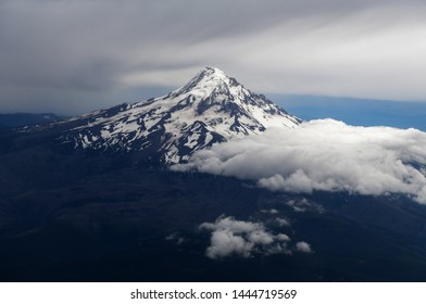 Aerial view of Mount Hood, a volcano in the Cascade Mountains in Oregon popular for hiking, climbing, snowboarding and skiing, despite risks of avalanche, crevasses and weather on the peak.