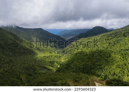 Aerial view of the mountain and mist in the Morne Trois Pitons National Park on the island of Dominica
