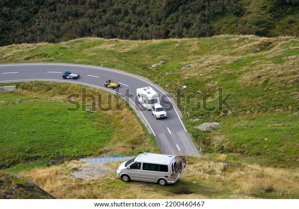 Aerial view of mountain pass\
road and cars at Swiss mountain pass Oberalppass on a late summer\
day. Photo taken September 5th, 2022, Oberalp Pass,\
Switzerland.