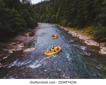 Aerial View Of Mountain River People Rafting In Creek. Extreme Vitality