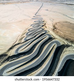 aerial view of the mountain road full of hairpin bends that connect Tashkurg Tajik Autonomous County and Wacha Township